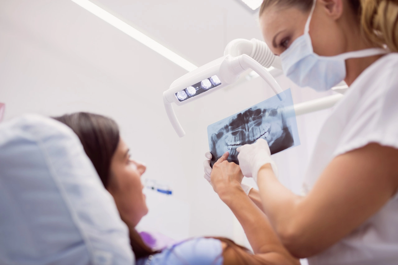 dentist-showing-x-ray-patient