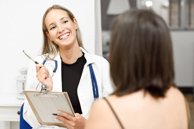 female-doctor-explaining-diagnosis-her-young-woman-patient